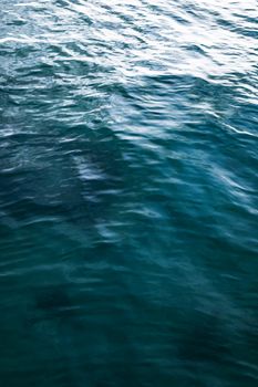 A serene view of ocean water showcasing gentle ripples and vibrant blue. Ideal for backgrounds.