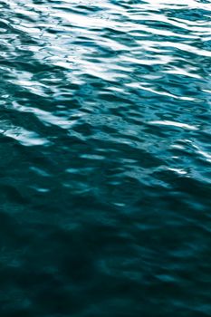 A tranquil view of calm ocean water with a reflective surface, capturing the beauty of nature.