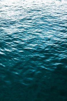 A dynamic capture of the ocean's surface with rich blue tones and gentle waves, offering a sense of tranquility.