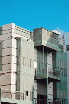 Historic wooden architecture of Al Balad, Jeddah under clear blue sky.