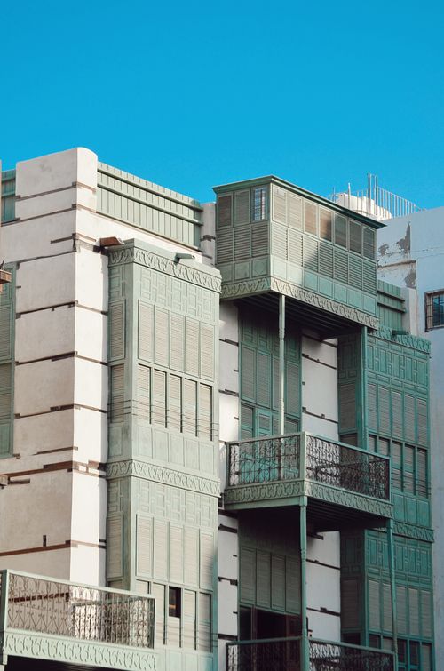 Free Historic wooden architecture of Al Balad, Jeddah under clear blue sky. Stock Photo