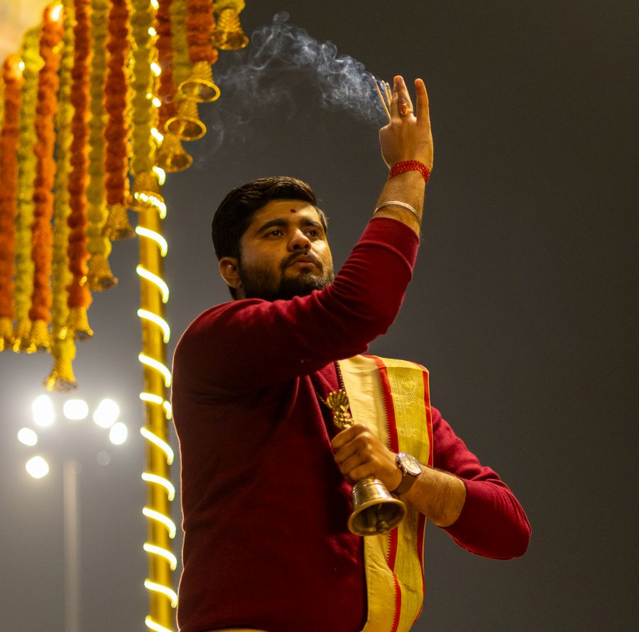 Pandit performing a Hindu ritual with incense