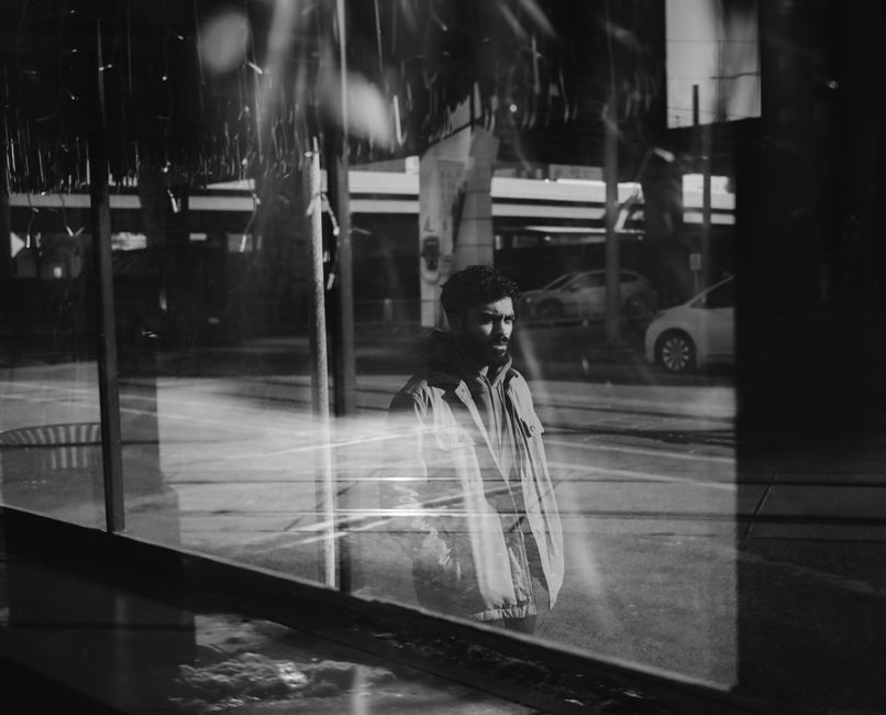 car window reflection person