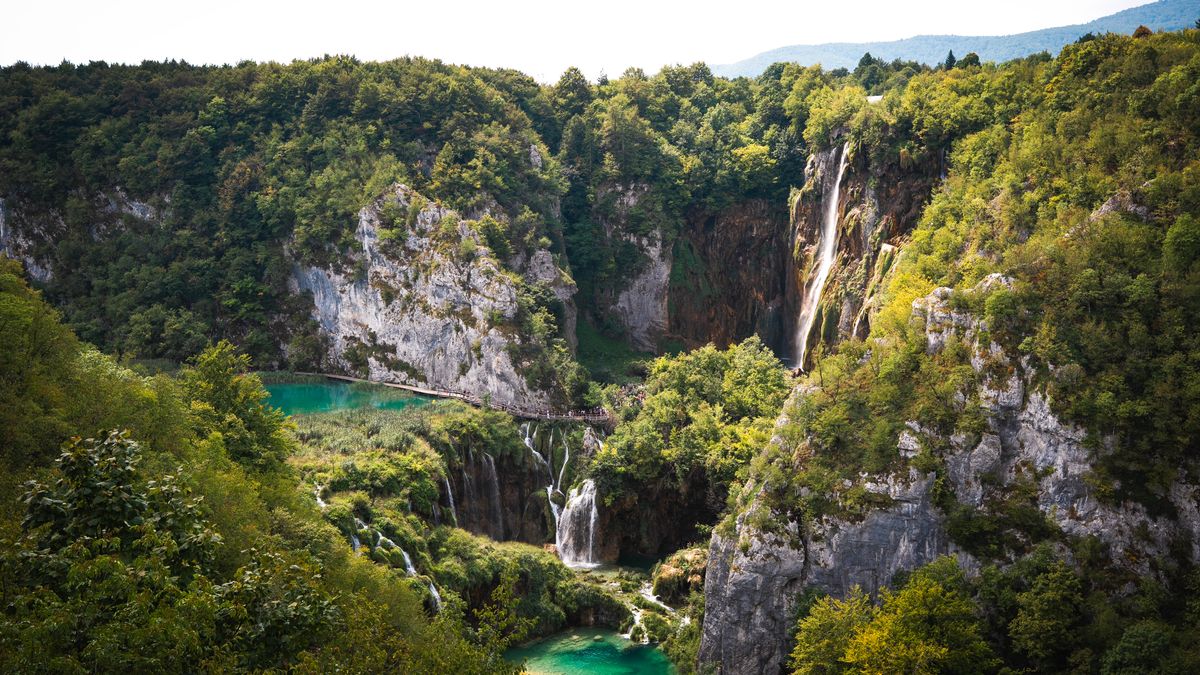 Waterfall cascading through greenery at Plitvice Lakes National Park