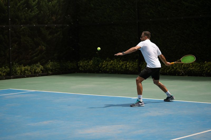 Tennis player hitting a backhand