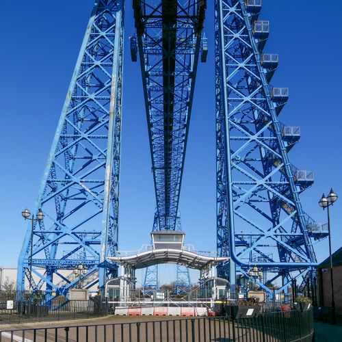 Free A detailed view of the iconic Middlesbrough Transporter Bridge steel structure in England under a clear blue sky. Stock Photo
