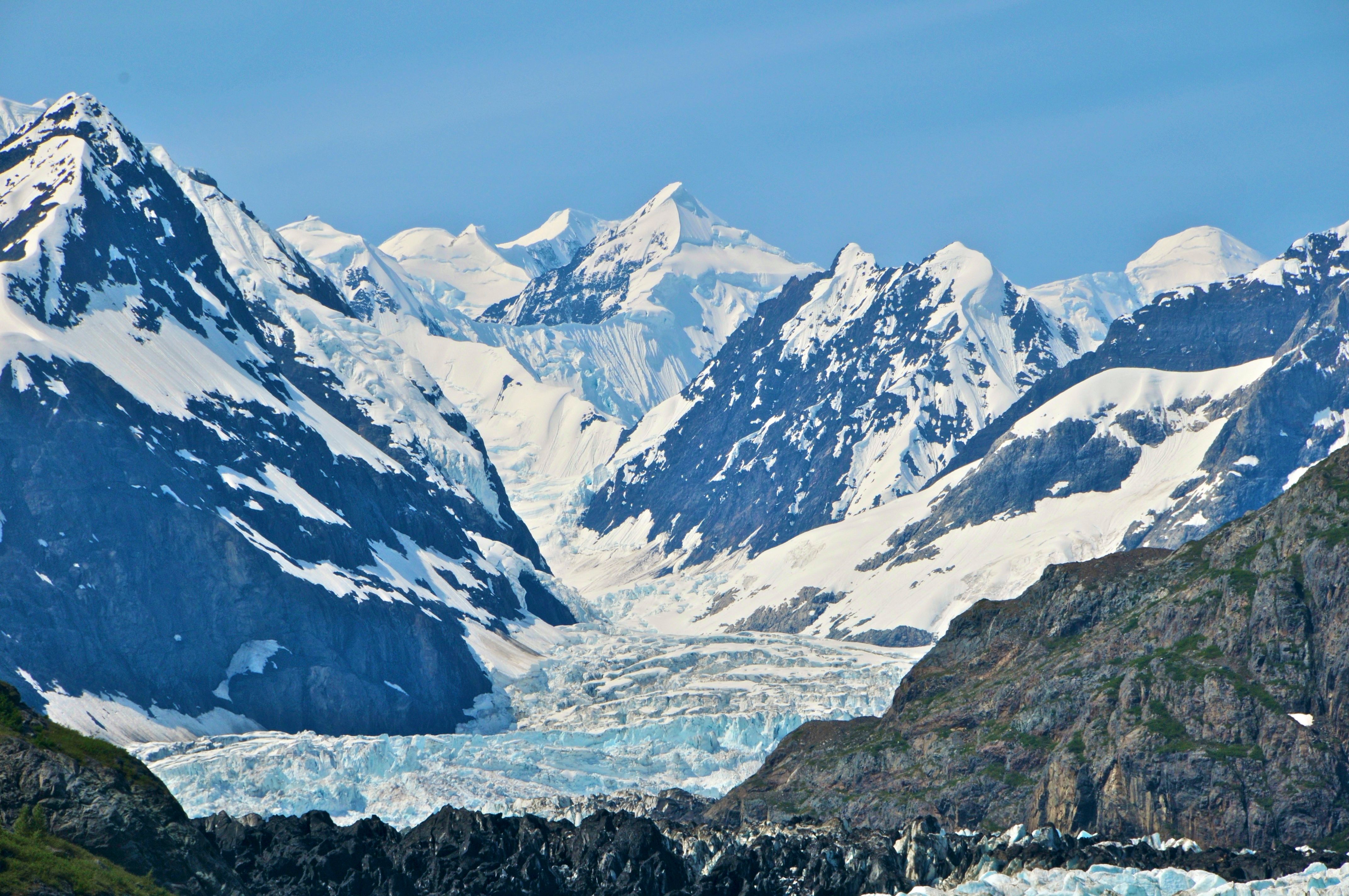 Glacier and Mountain Viewing Intro Flight - Breathtaking view of snow-covered peaks and glaciers amidst rugged terrain.