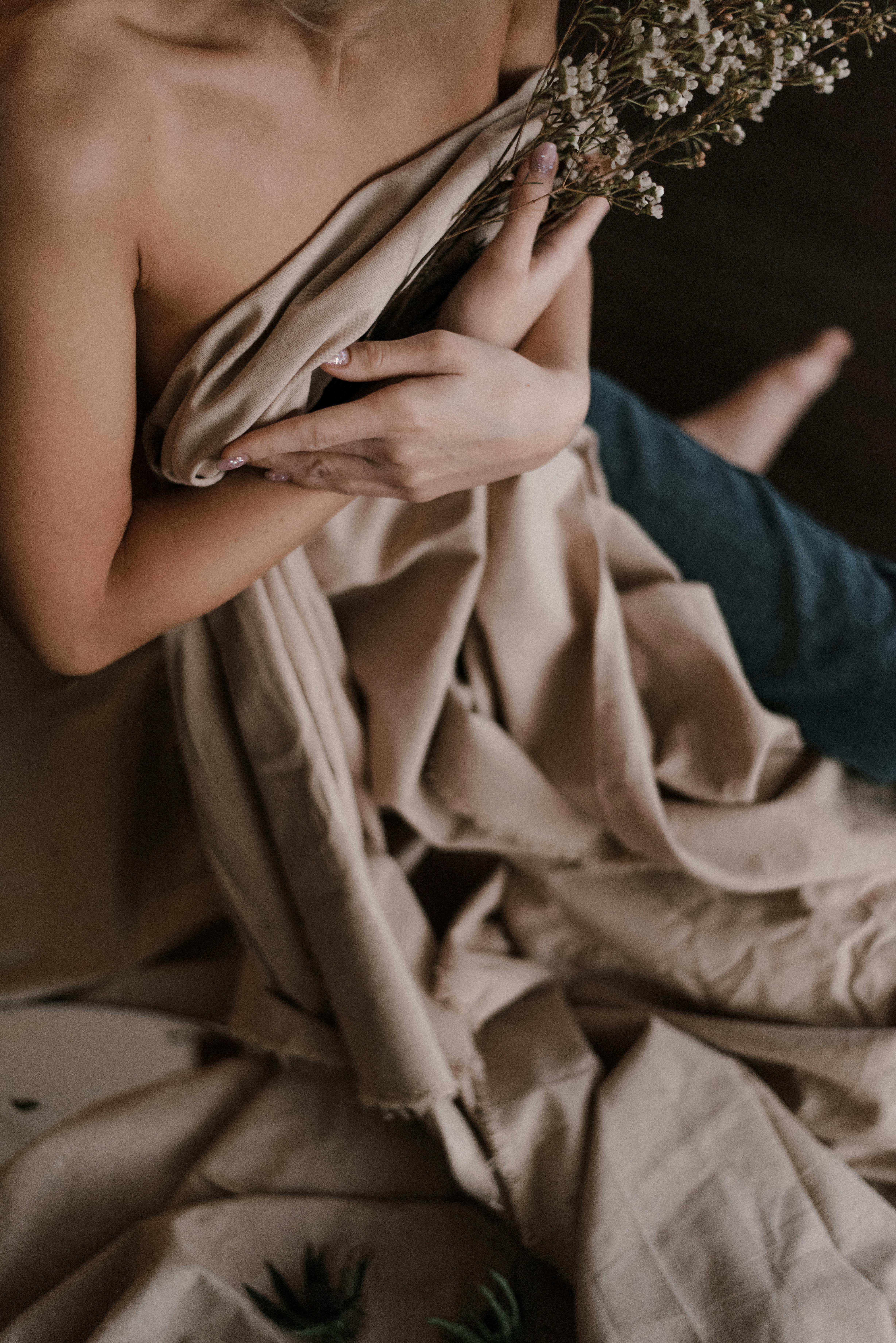 woman covering her body with brown blanket