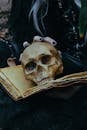 Mysterious Skull and Ancient Book in Dark Setting