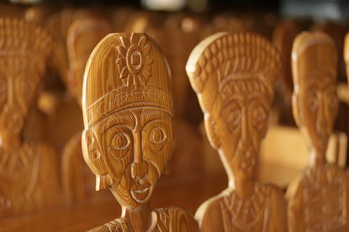 Free Close-up of carved wooden figures highlighting intricate details and craftsmanship in natural light. Stock Photo