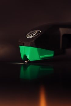 Detailed shot of a turntable stylus touching a vinyl record, capturing the essence of analog music.