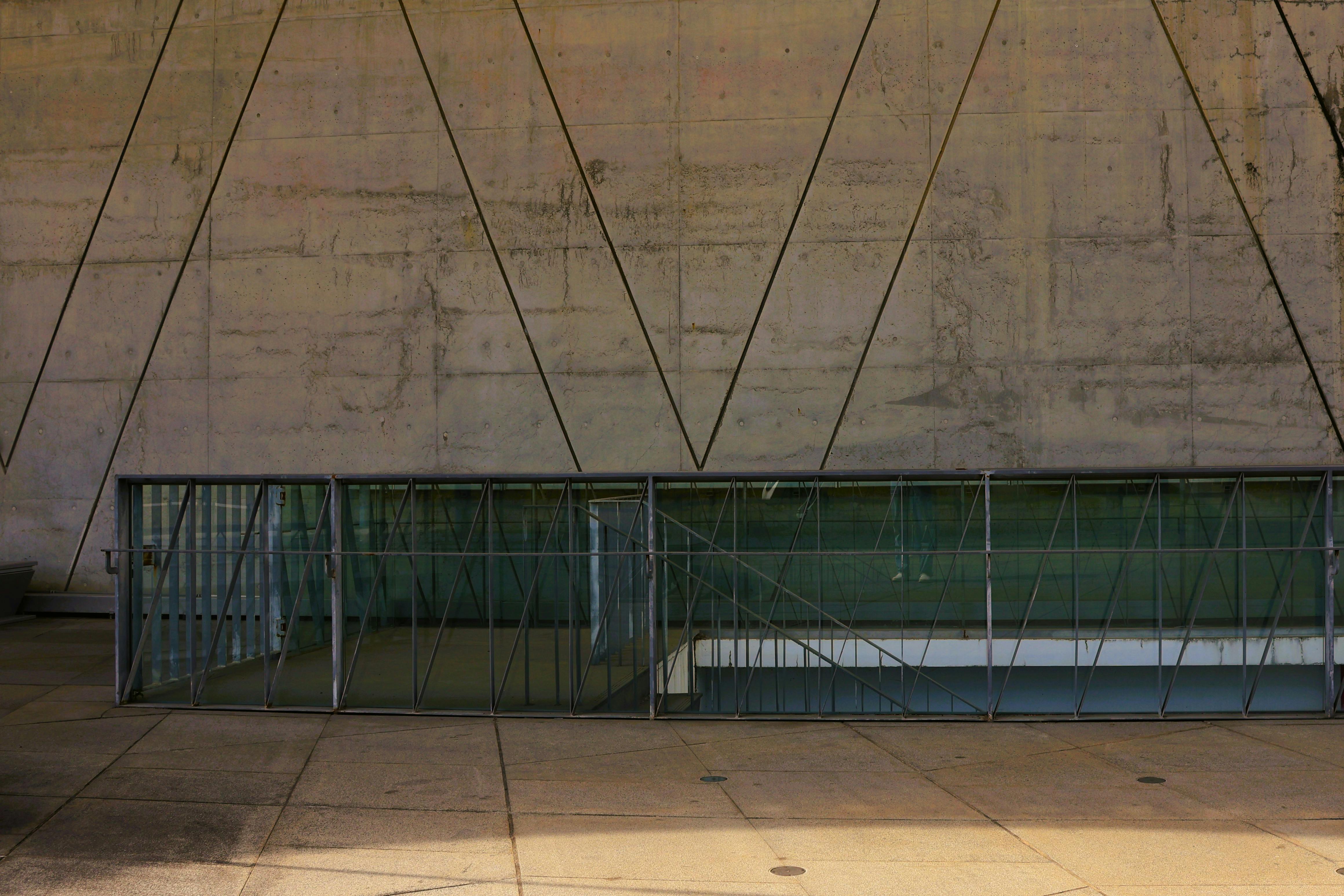 Free Modern architectural design featuring geometric glass structures and concrete walls in Taiwan. Stock Photo