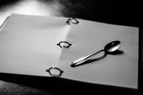 Silver Spoon on White Paper