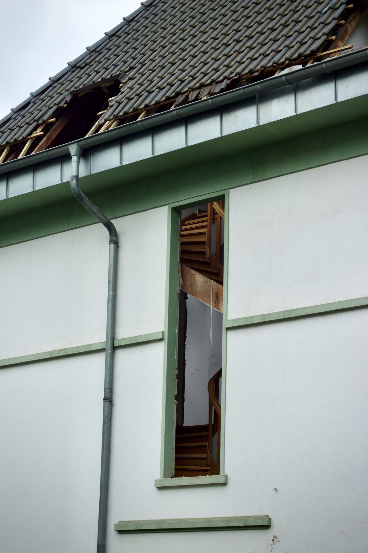 Roof damage and exposed roof structure