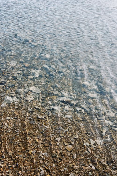 Free Crystal clear water revealing a rocky bed in Konaev, Almaty Region, Kazakhstan. Stock Photo