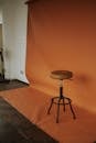 Minimalist Studio Setup with Orange Backdrop