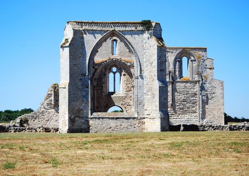 Free Sunlit medieval church ruins stand majestically under a clear blue sky. Stock Photo