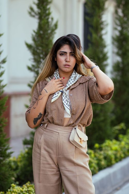 Free Portrait of a stylish woman posing outdoors in Tehran, Iran, showcasing modern fashion. Stock Photo