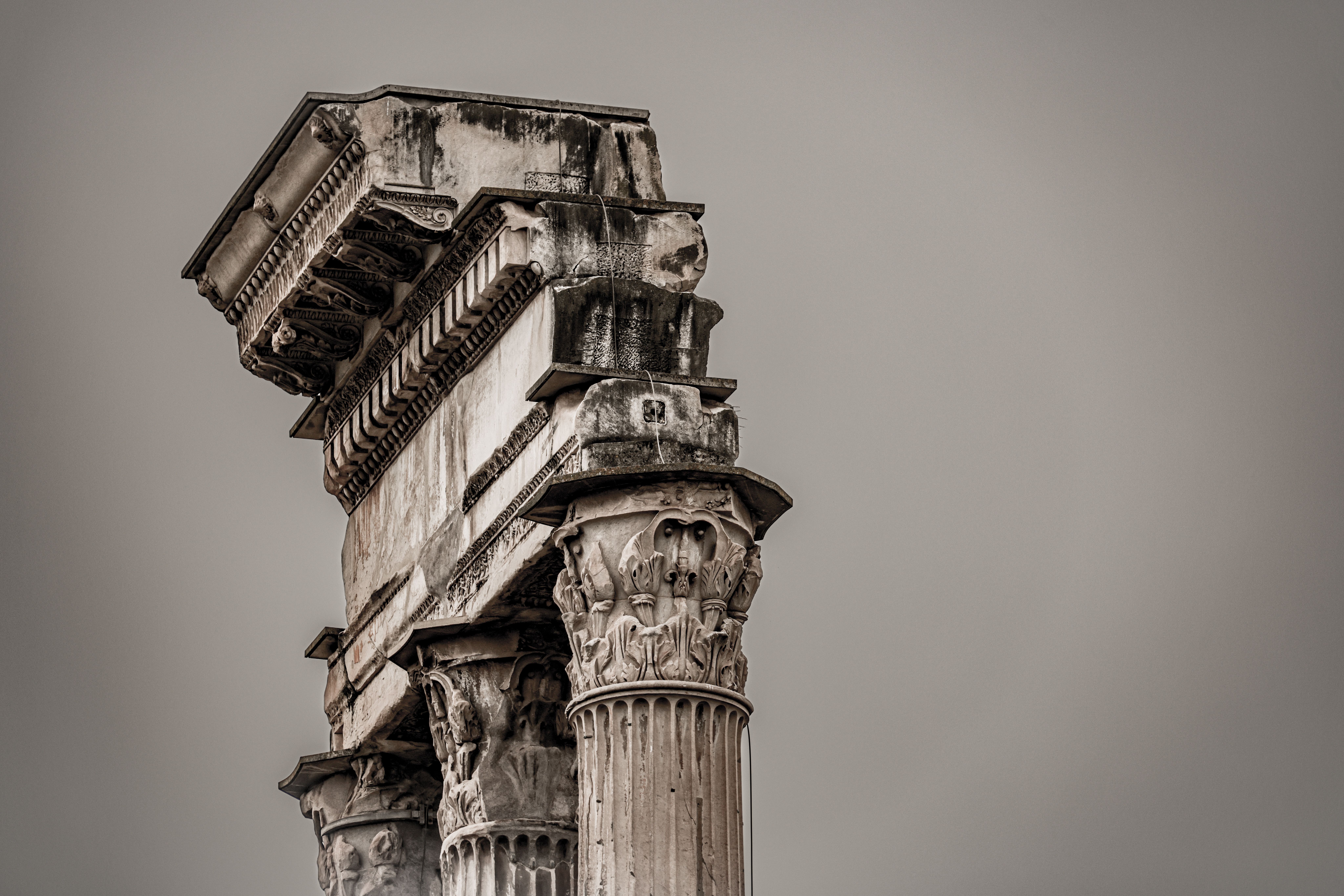 Ancient Roman Columns Against Overcast Sky · Free Stock Photo