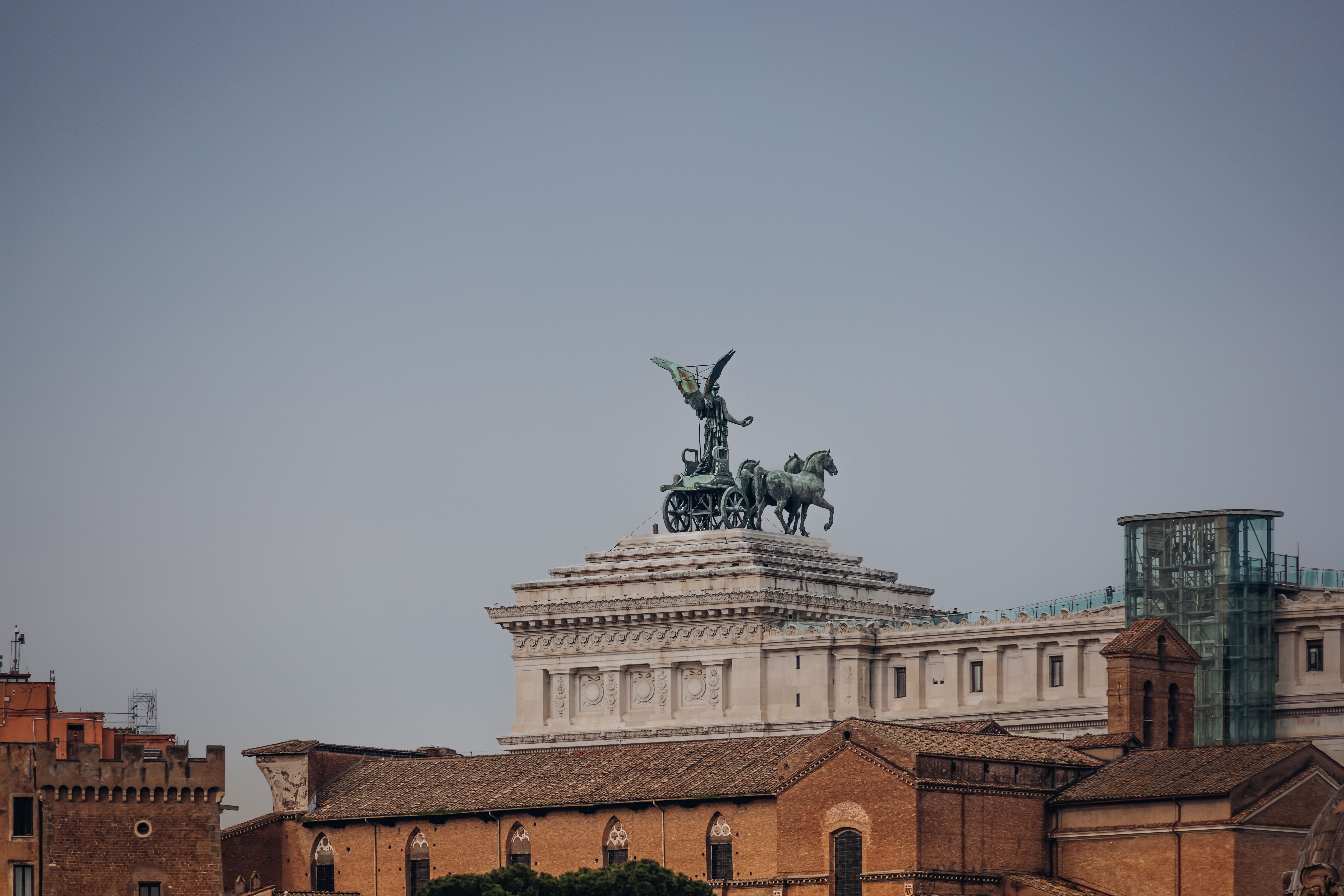 Distant view of the iconic Altare della Patria in Rome, featuring the Quadriga statue atop the monument.