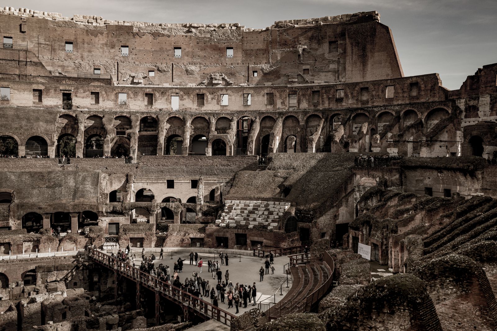 Early morning light inside the Colosseum reveals the layout of the underground chambers below the arena floor.