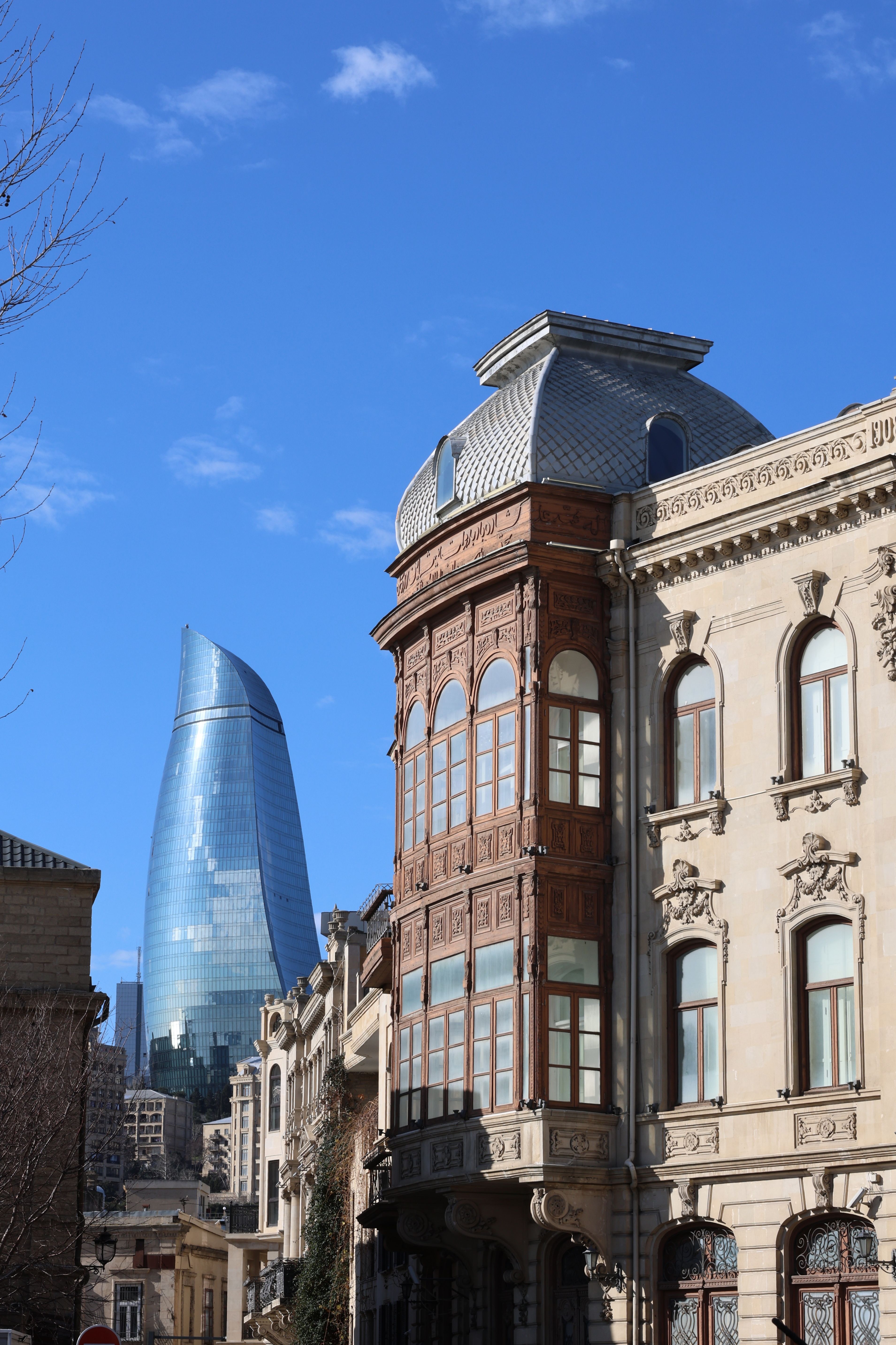 Free Baku city skyline showcasing modern and historic architecture under a clear blue sky. Stock Photo