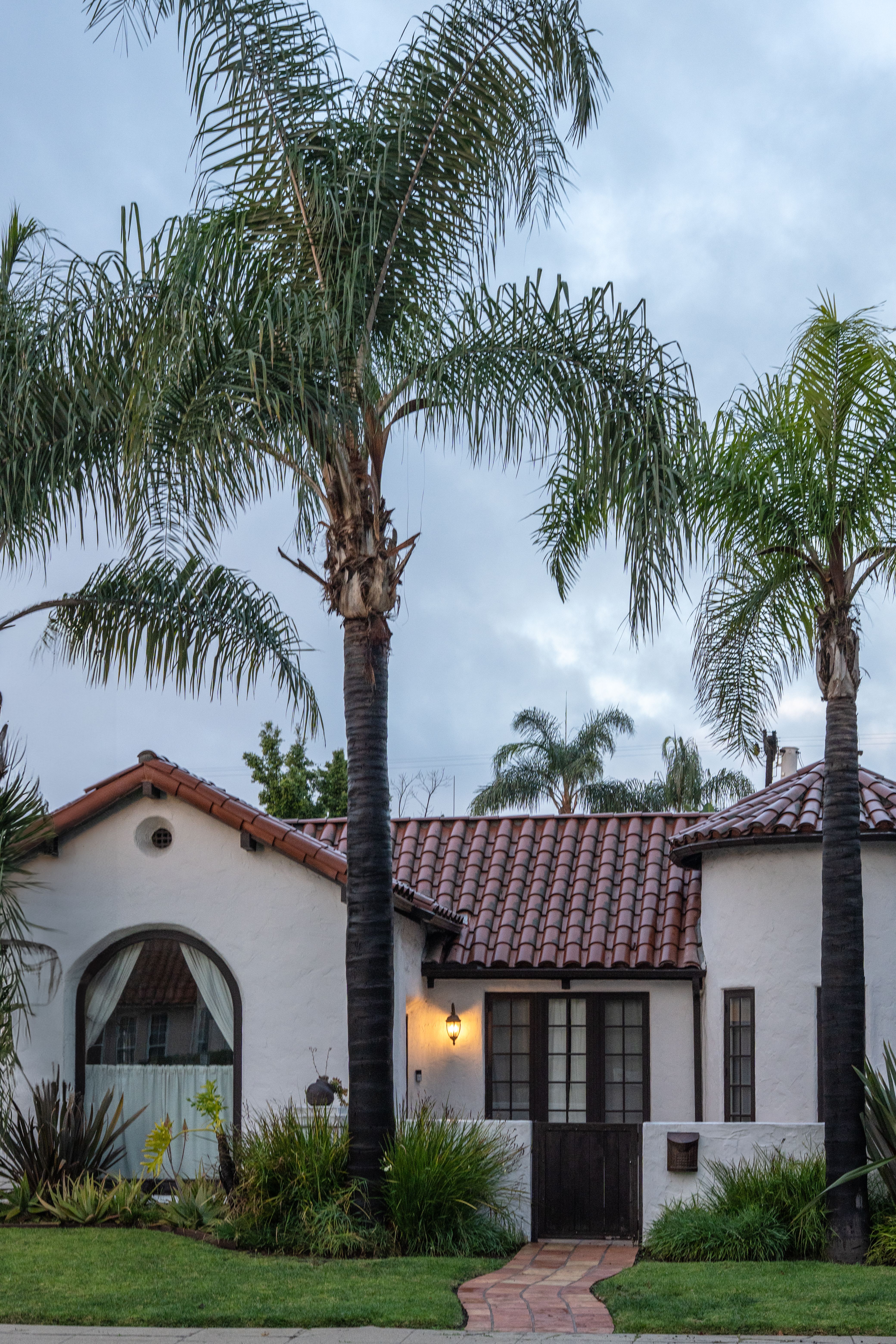 A sunny coastal Southern California home with palm trees in Encinitas