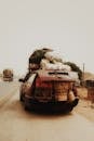 Vintage Overloaded Car on Dusty Country Road
