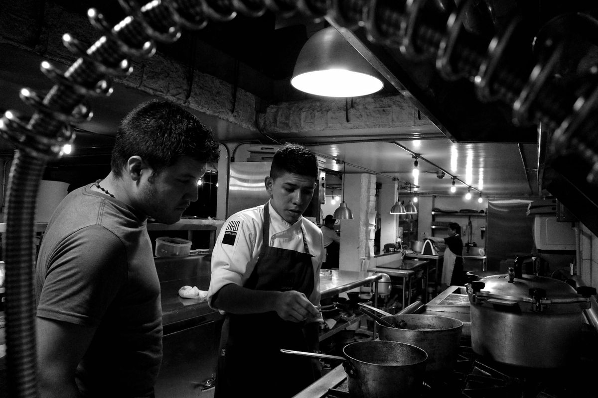 Chefs collaborating in a restaurant kitchen