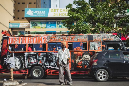 Colorful matatu with graffiti art on Nairobi streets, capturing urban vibrancy and culture.