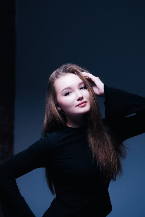 Portrait of a Young Woman with Long Hair · Free Stock Photo