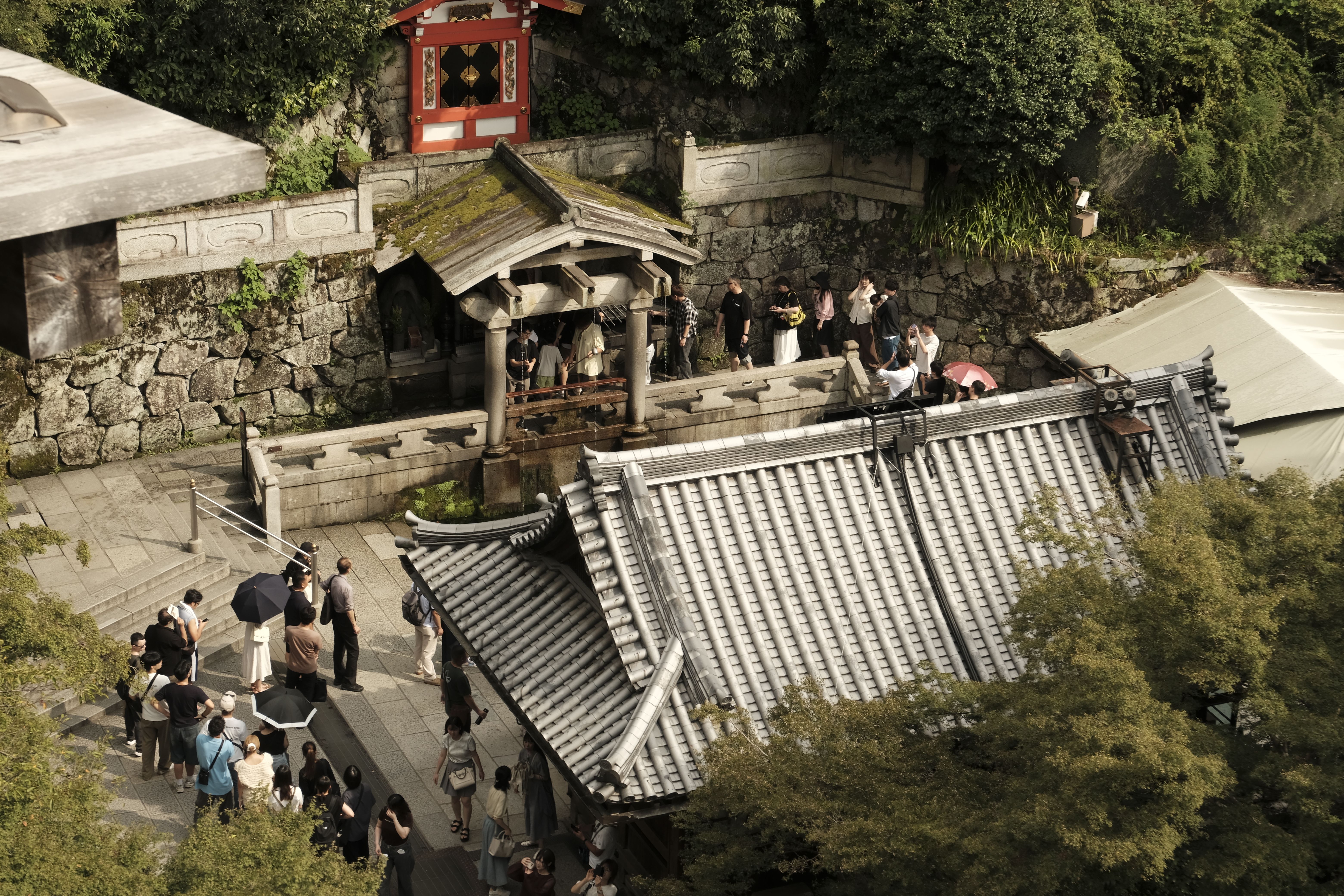 Aerial view of tourists visiting Kiyomizu-dera Temple in Kyoto, a UNESCO World Heritage Site.