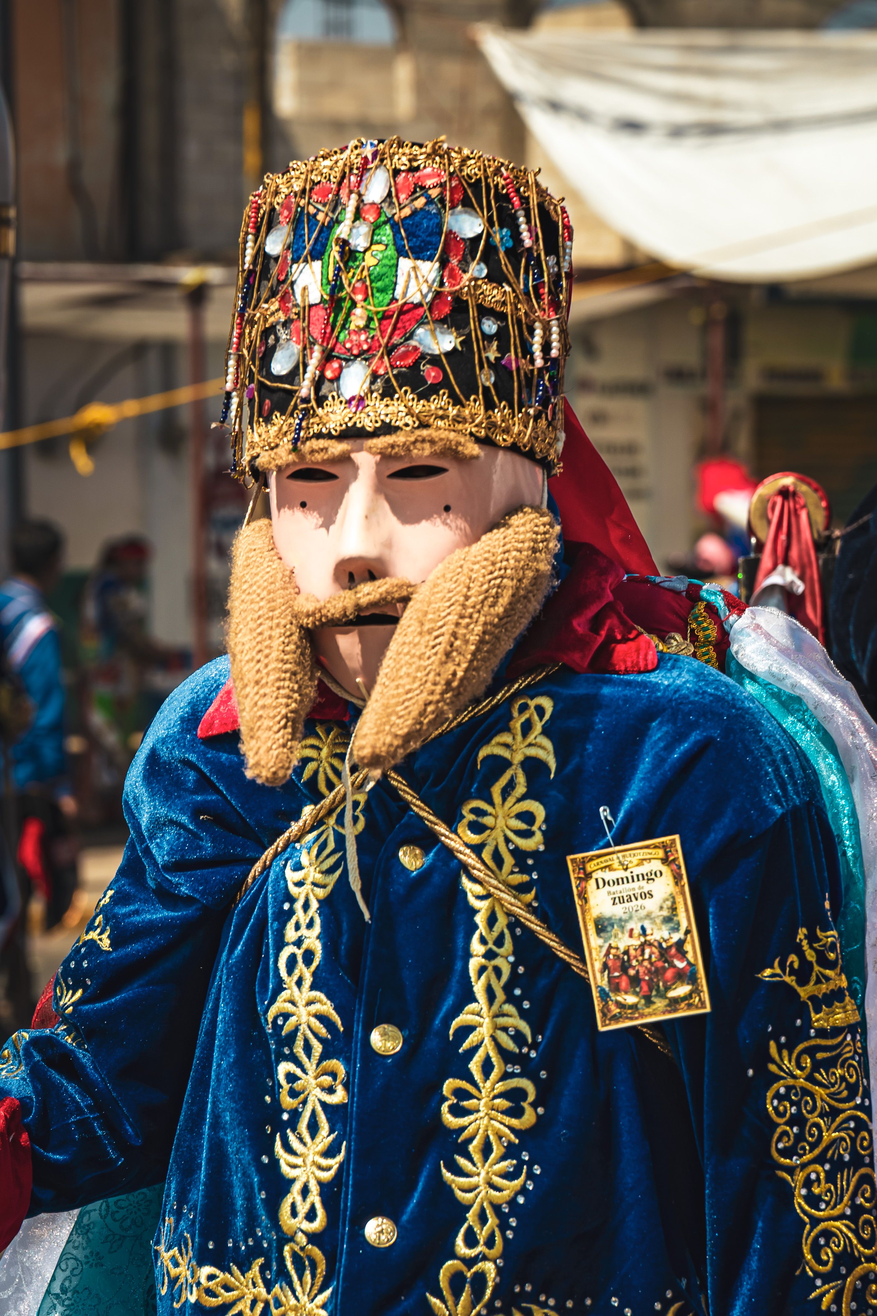 Man in intricate festival costume during the Huejotzingo Carnival in Puebla, Mexico.