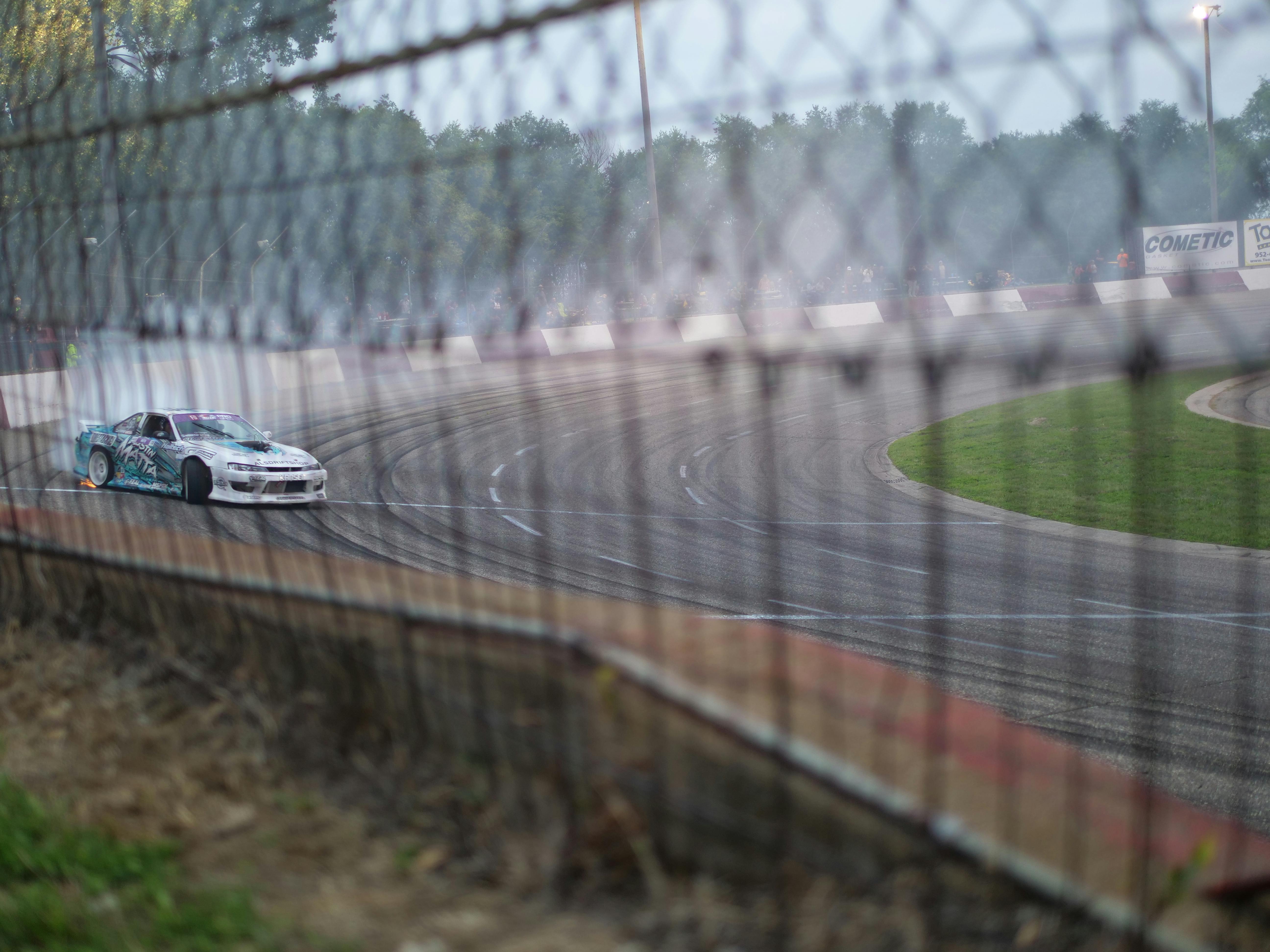 A drift car takes a sharp turn on the track in Elko, Minnesota.