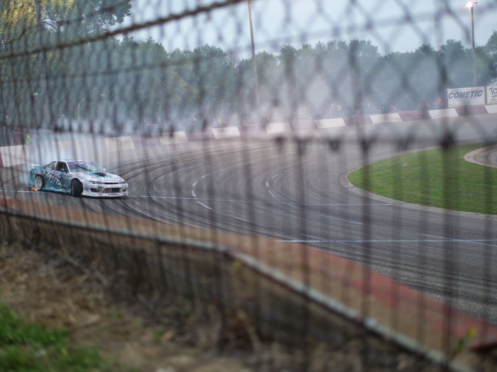 A drift car takes a sharp turn on the track in Elko, Minnesota.