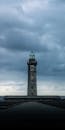 Dramatic Lighthouse Against Stormy Sky