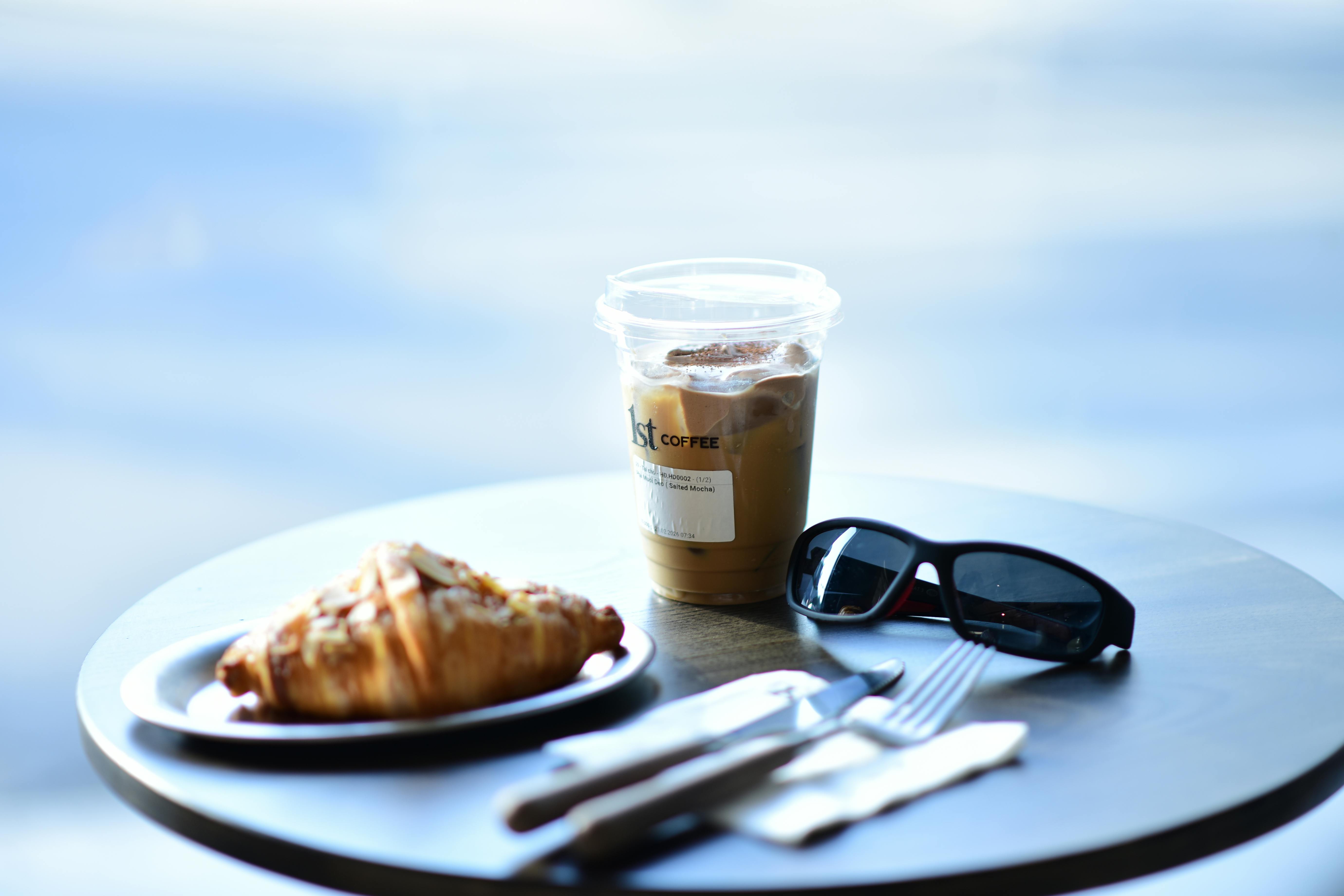 Wise debit card on a cafe table in Gangnam beside a Korean coffee and pastry