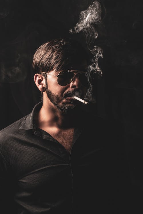 Man Wearing Sunglasses Smoking