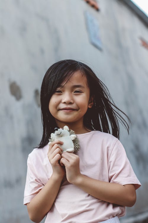 Little Girl Holding Her Stuffed Toy