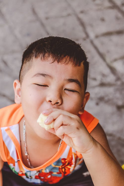 Free Little Boy Eating Stock Photo