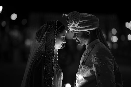 A beautifully captured black and white portrait of an Indian couple during their wedding. Intimate and graceful lighting.