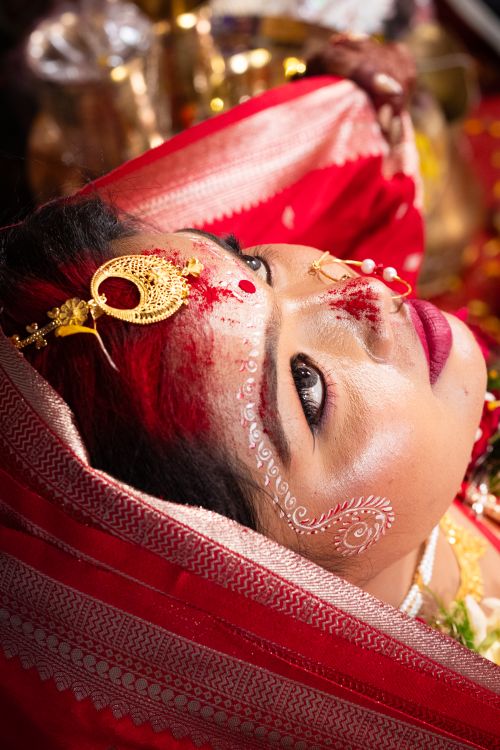 Free Close-up of a South Asian bride in traditional attire with intricate jewelry and makeup. Stock Photo