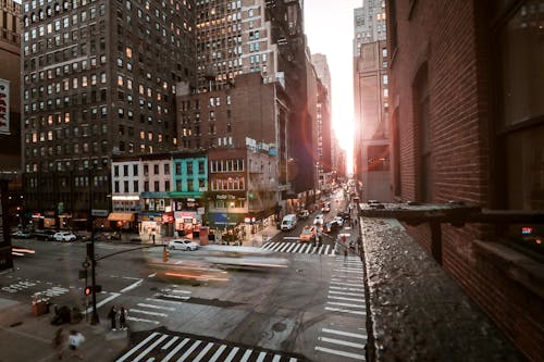 Free Cars On Road Between High Rise Buildings Stock Photo