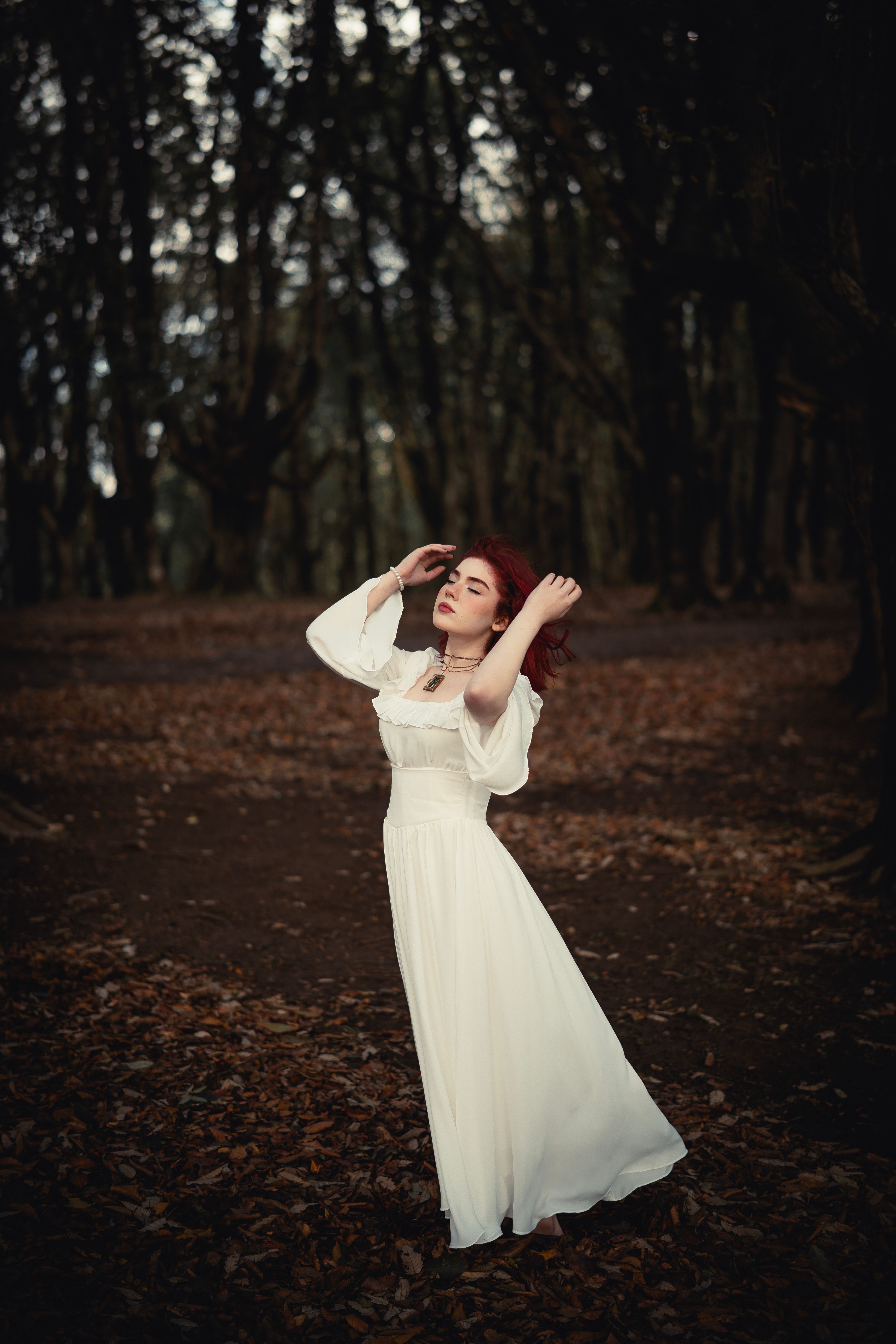 Woman in Flowing White Dress in Enchanted Forest · Free Stock Photo
