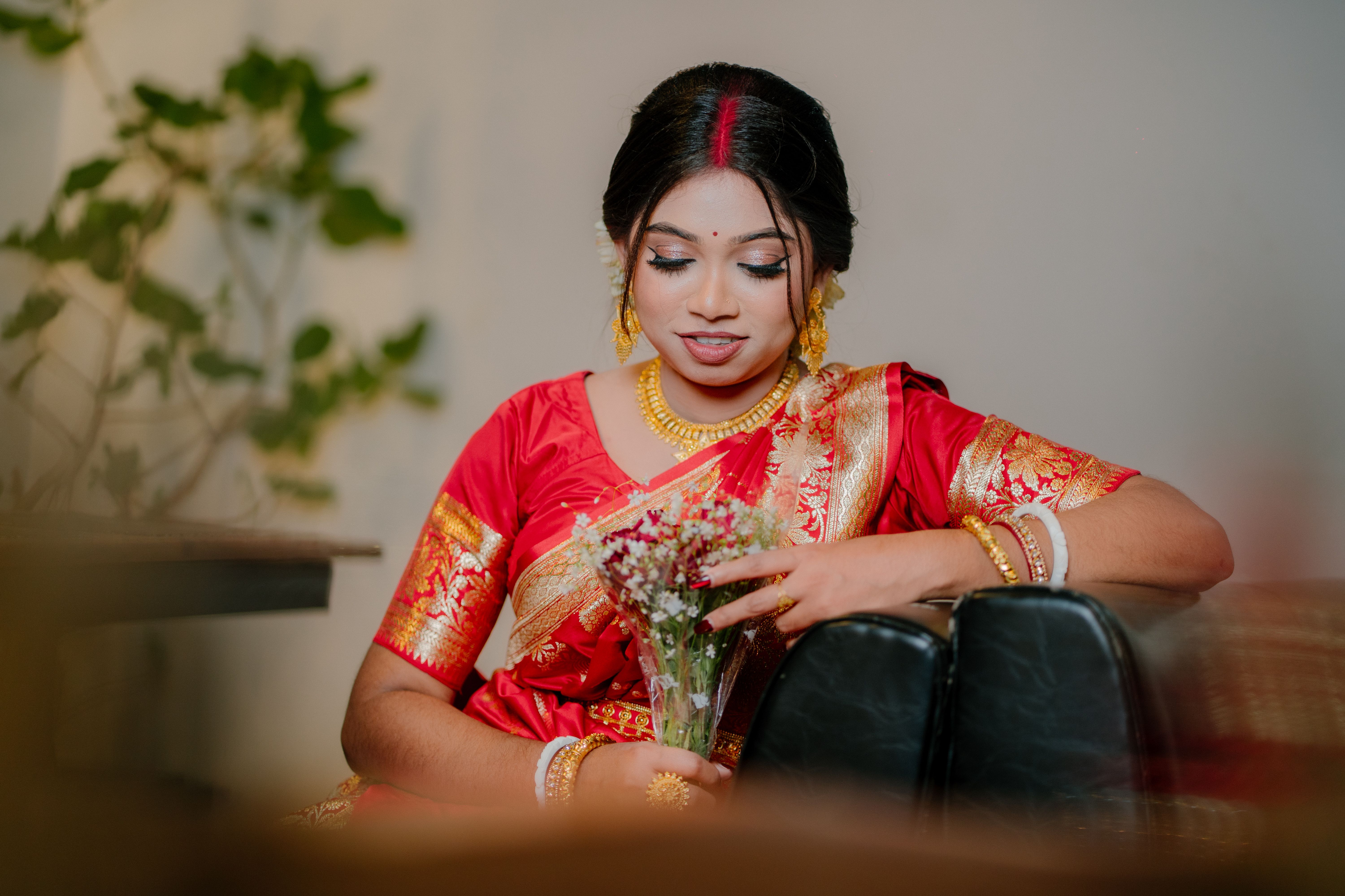 Young Woman in Traditional Red Indian Saree Indoors · Free Stock Photo