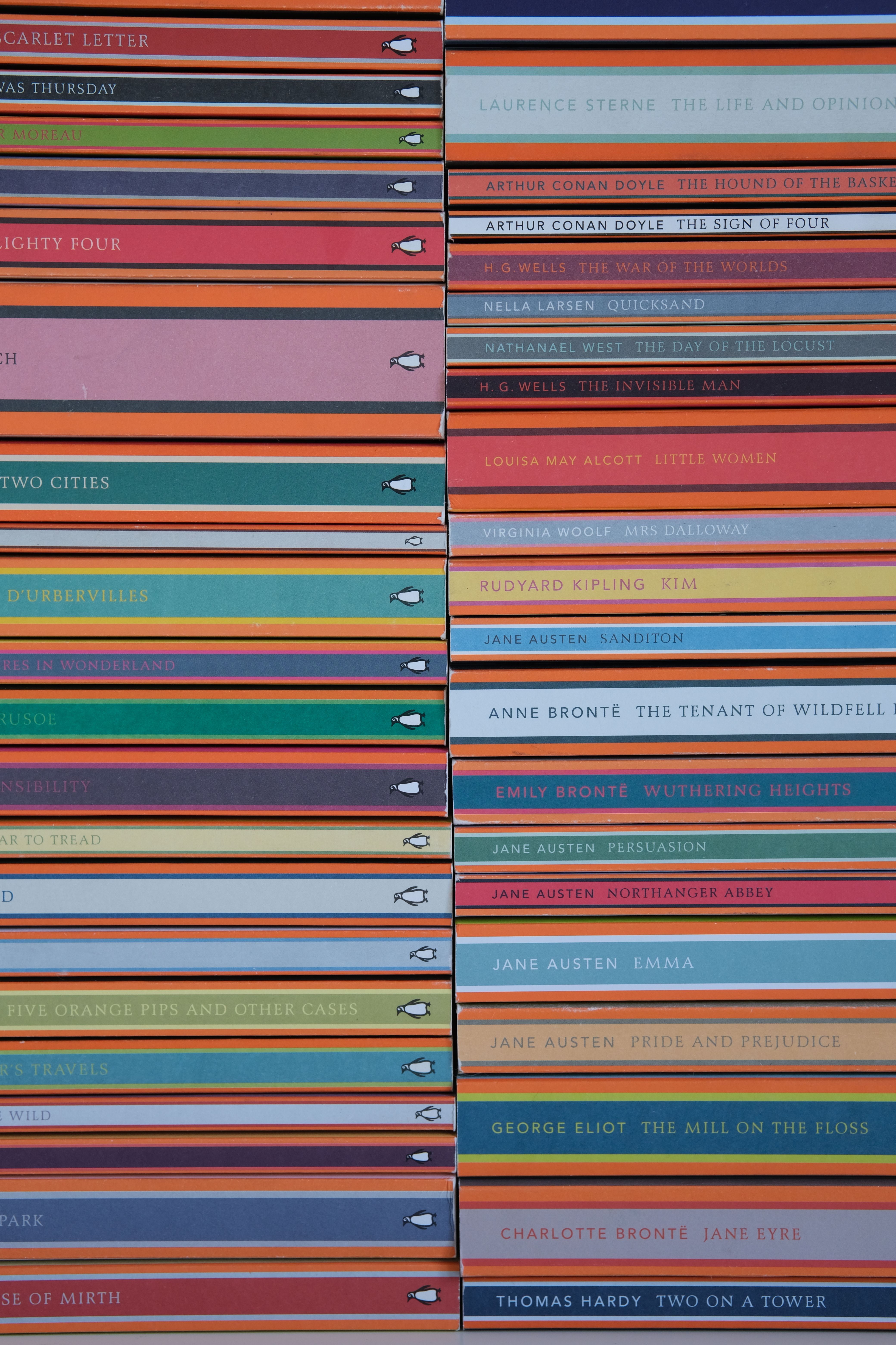 A colorful stack of classic literature books displayed from an above perspective, showcasing various titles.