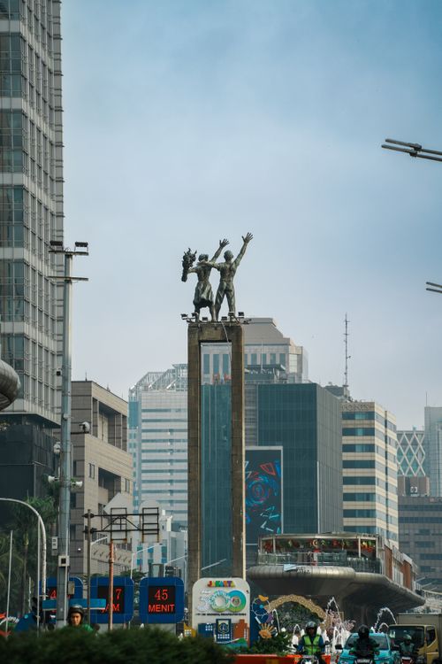 Free The iconic Welcome Monument stands tall against Jakarta's modern skyline. Stock Photo