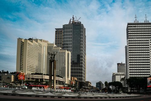 Free High-rise buildings and fountain at Bundaran HI, Jakarta during daytime. Stock Photo