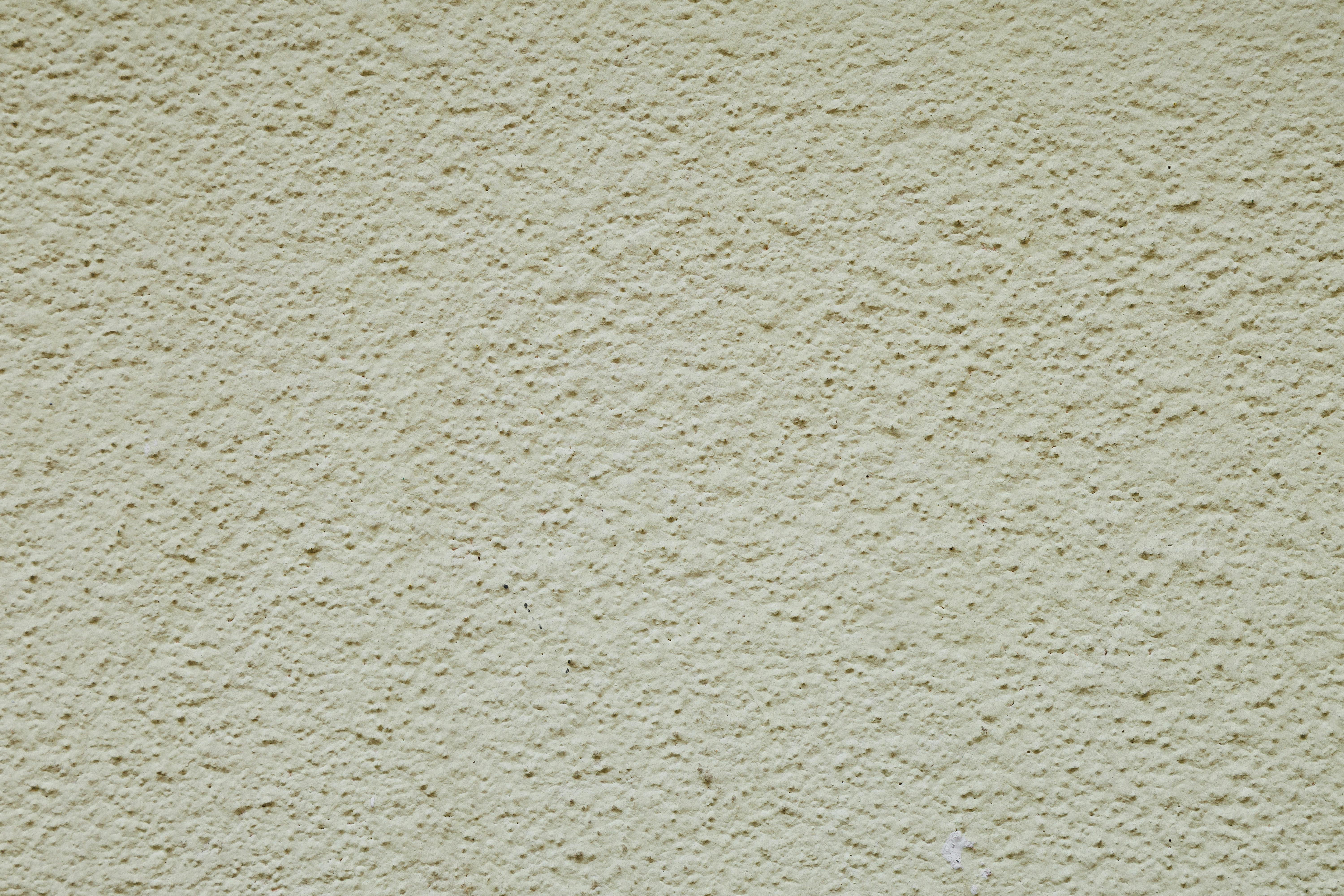 Gratis Høyoppløselig bilde av en beige teksturert vegg, perfekt for bakgrunner eller designelementer. Arkivbilde