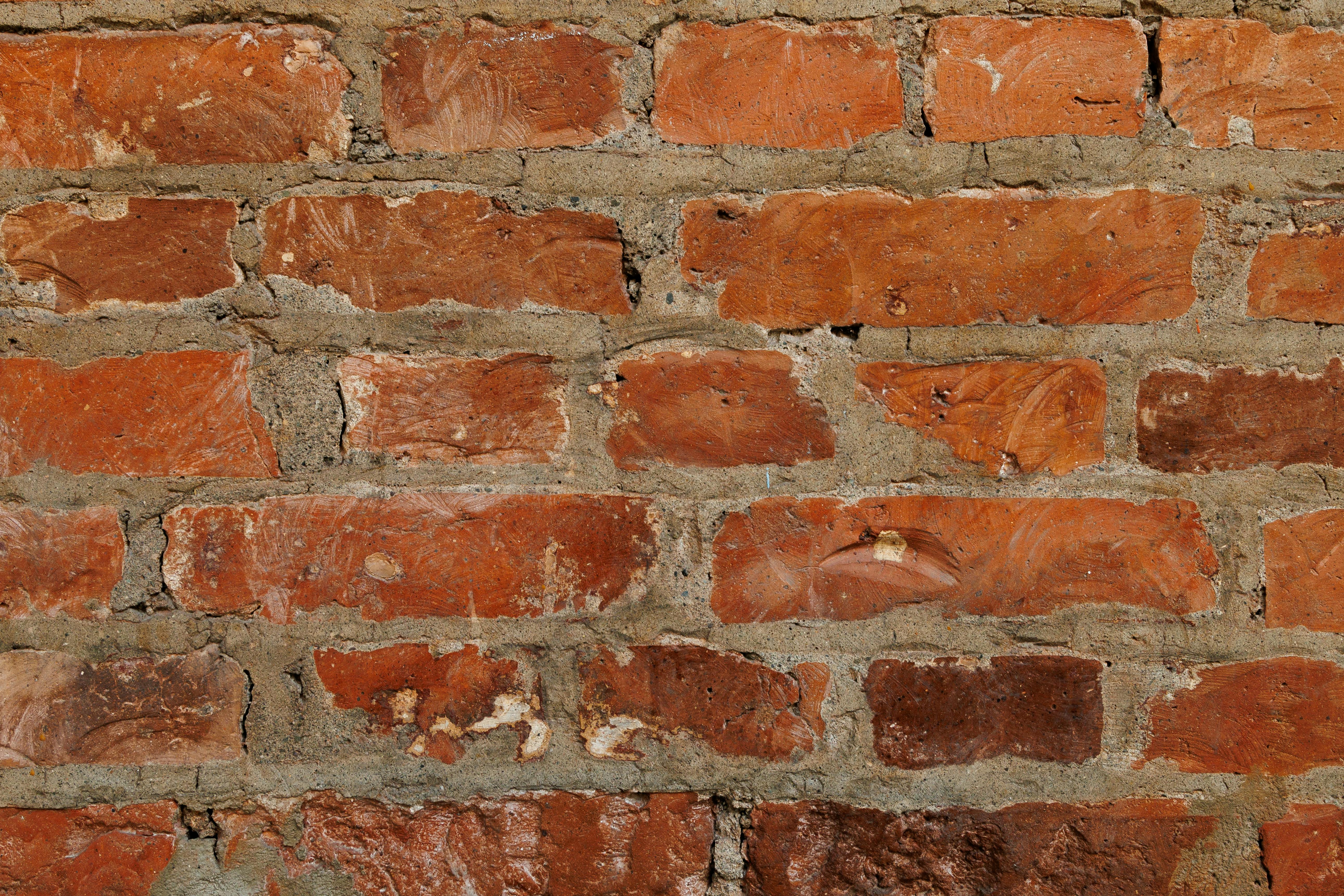 Gratuit Vedere detaliată a unui zid rustic din cărămidă roșie cu mortar vizibil, care prezintă textura și modelul. Fotografie de stoc